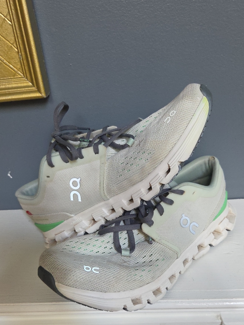 On Cloud Running Shoes in Light Beige with Green Accents